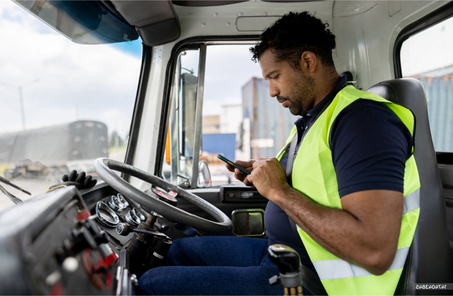 Man on phone in semi cab